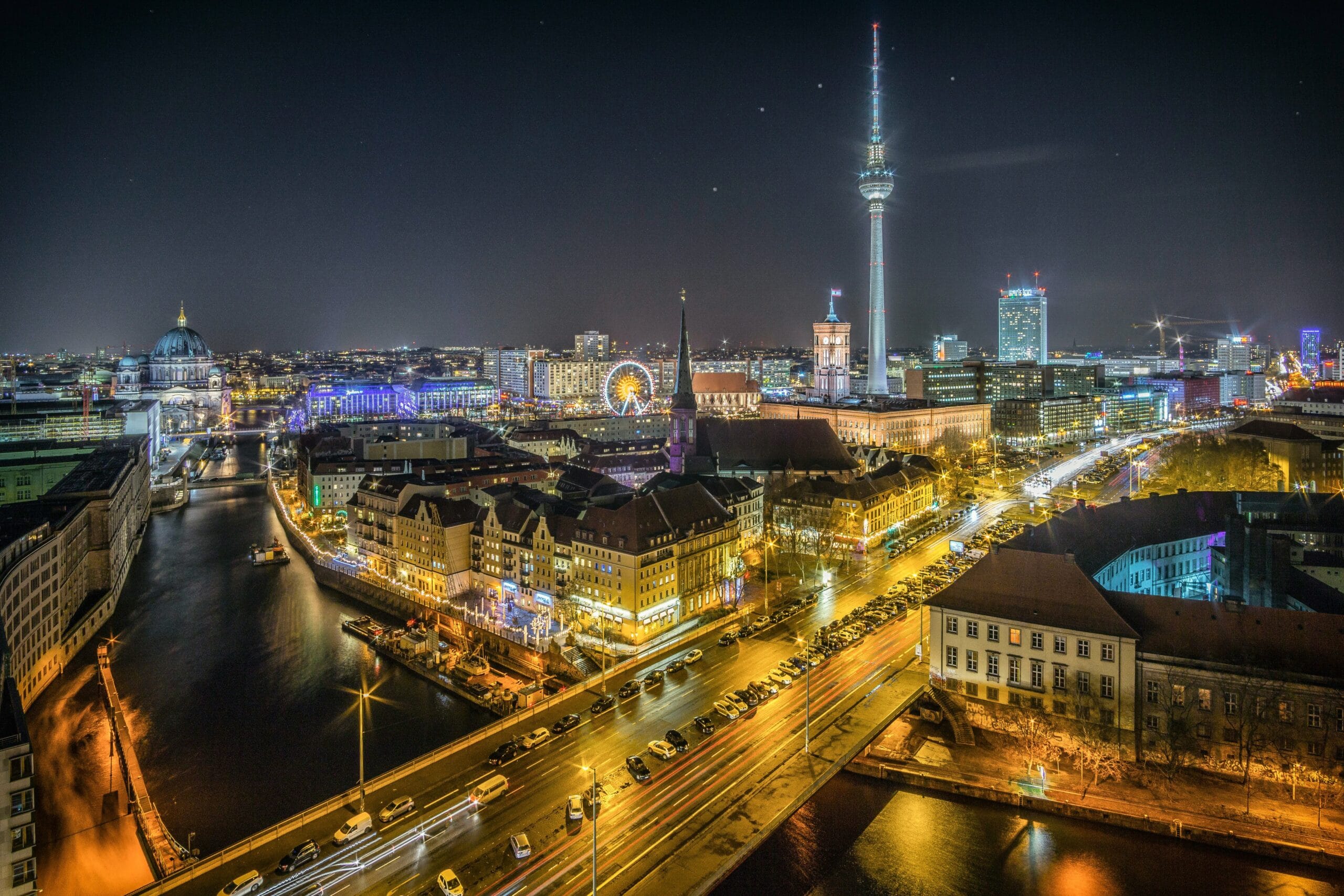 Berlin at night with city lights illuminating the skyline