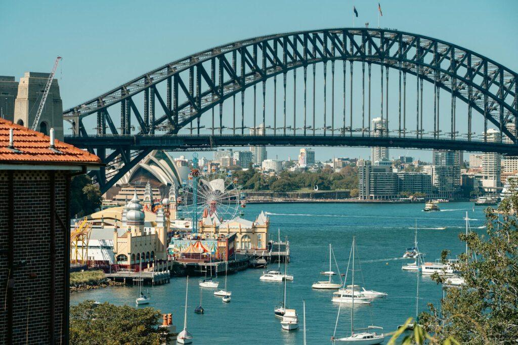 various sailboats under the sydney harbour bridge