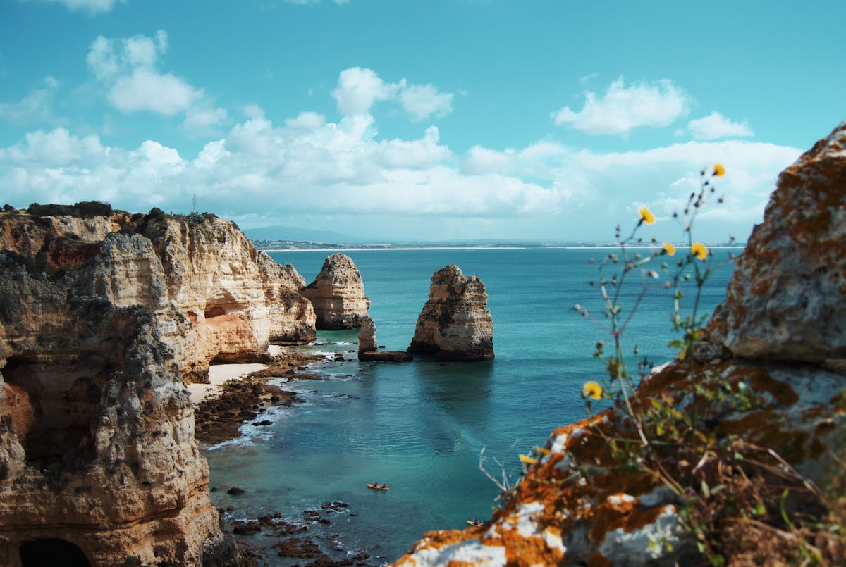 Dramatic limestone cliffs and clear turquoise ocean at Ponta da Piedade, Algarve