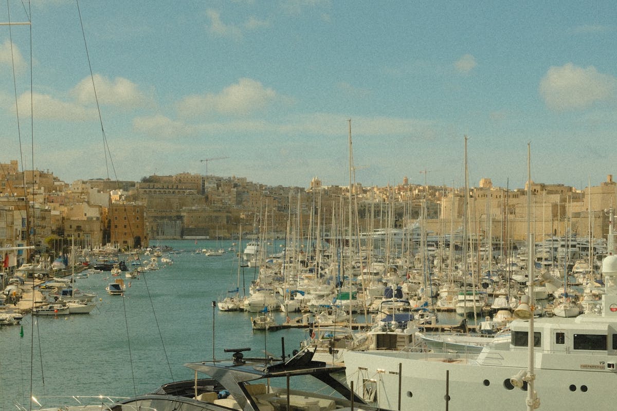Valletta harbour with yachts moored against Malta's historic limestone buildings