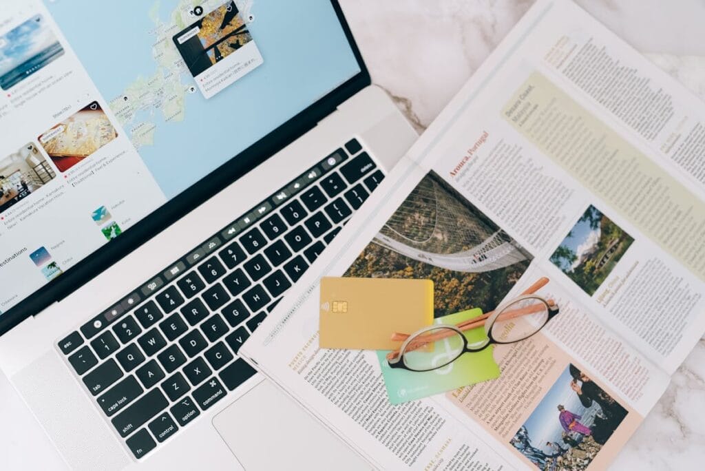 Travel planning with laptop and credit cards for British Airways booking