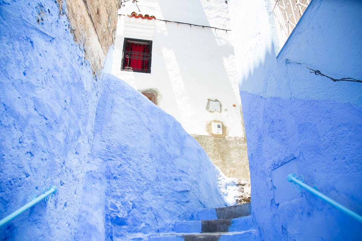 Blue-painted steps and walls in Chefchaouen, Morocco's blue city.