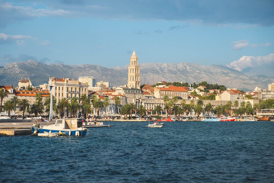 Split's palm-lined waterfront and the bell tower of Diocletian's Palace, seen from the sea