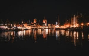 Gdansk Old Town at night with coloured lights reflecting on the Motlawa River