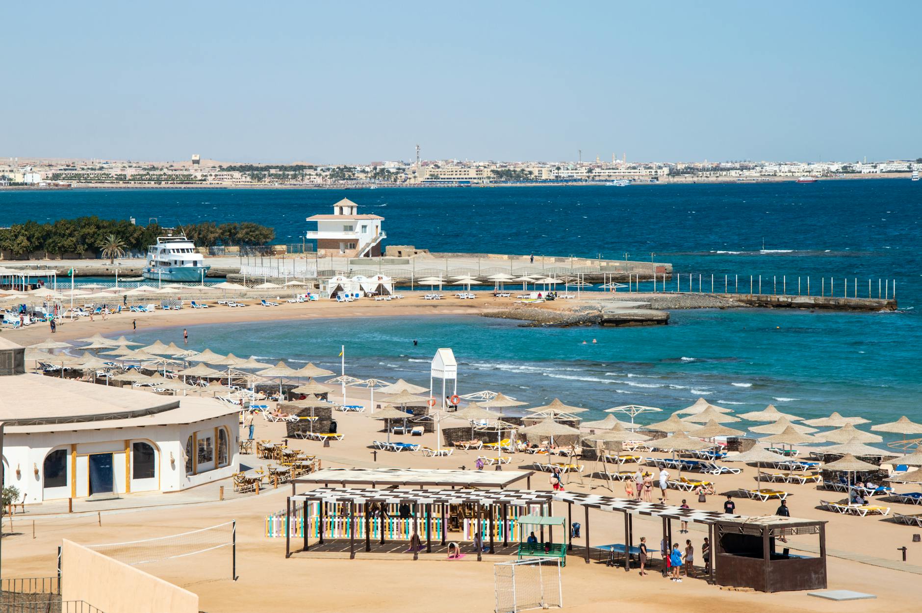 Aerial view of beach resort with sunbeds and blue sea in Hurghada, Egypt