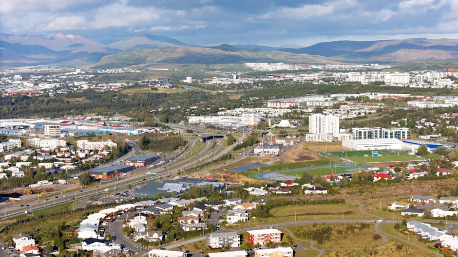 Aerial view of Reykjavik city with mountains and harbour in the background, Iceland