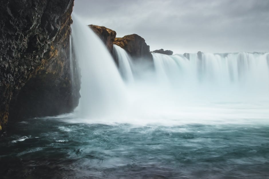 Godafoss waterfall cascading over a wide horseshoe ledge in northern Iceland