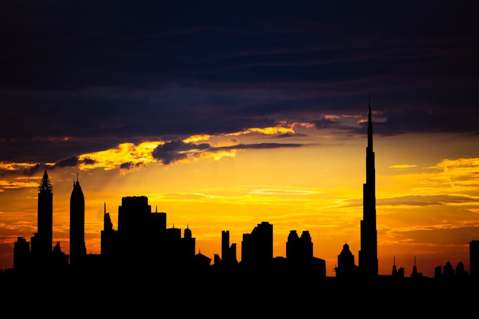Dubai skyline with Burj Khalifa silhouette at sunset