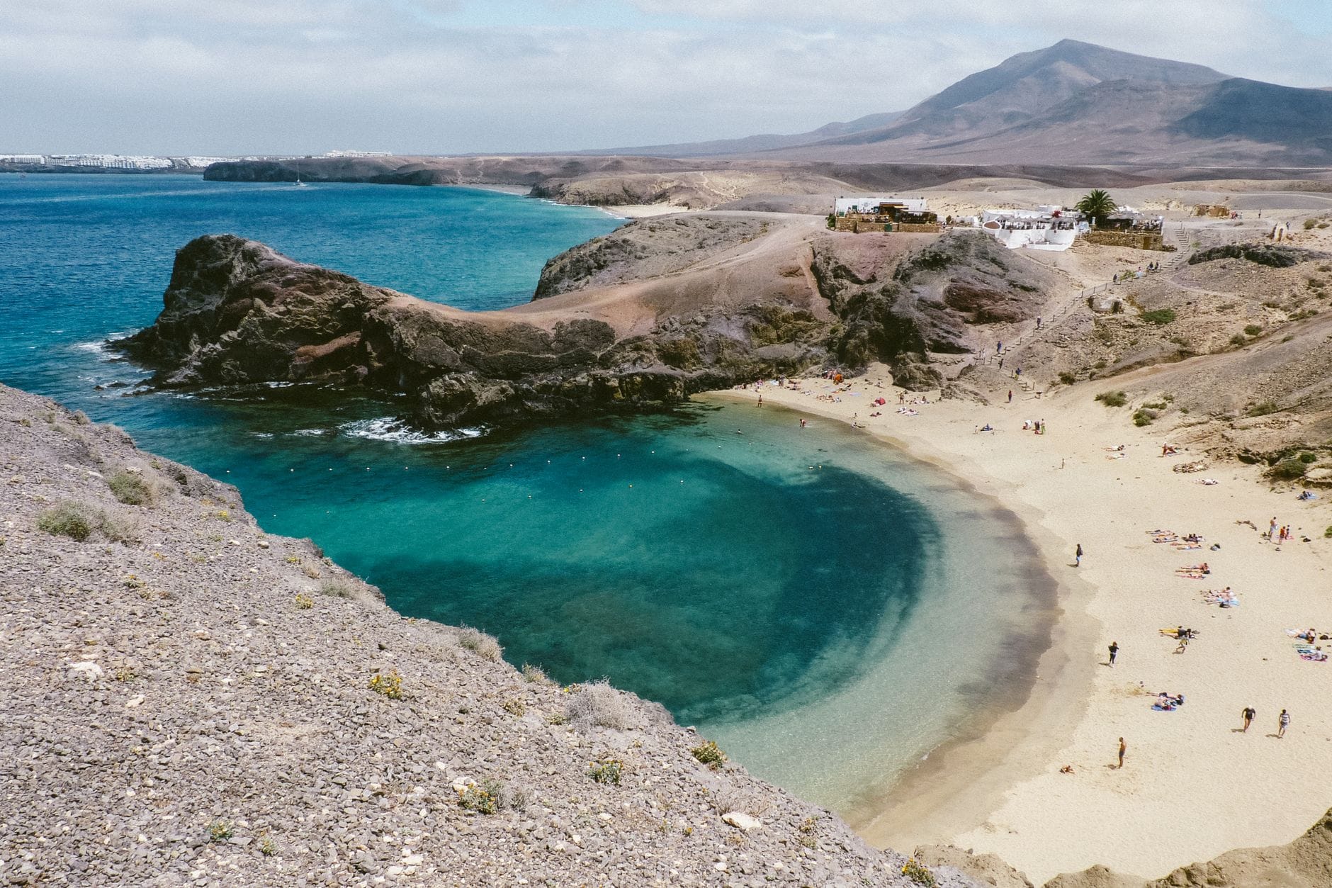 Sandy shore near turquoise ocean water at Lanzarote, Canary Islands