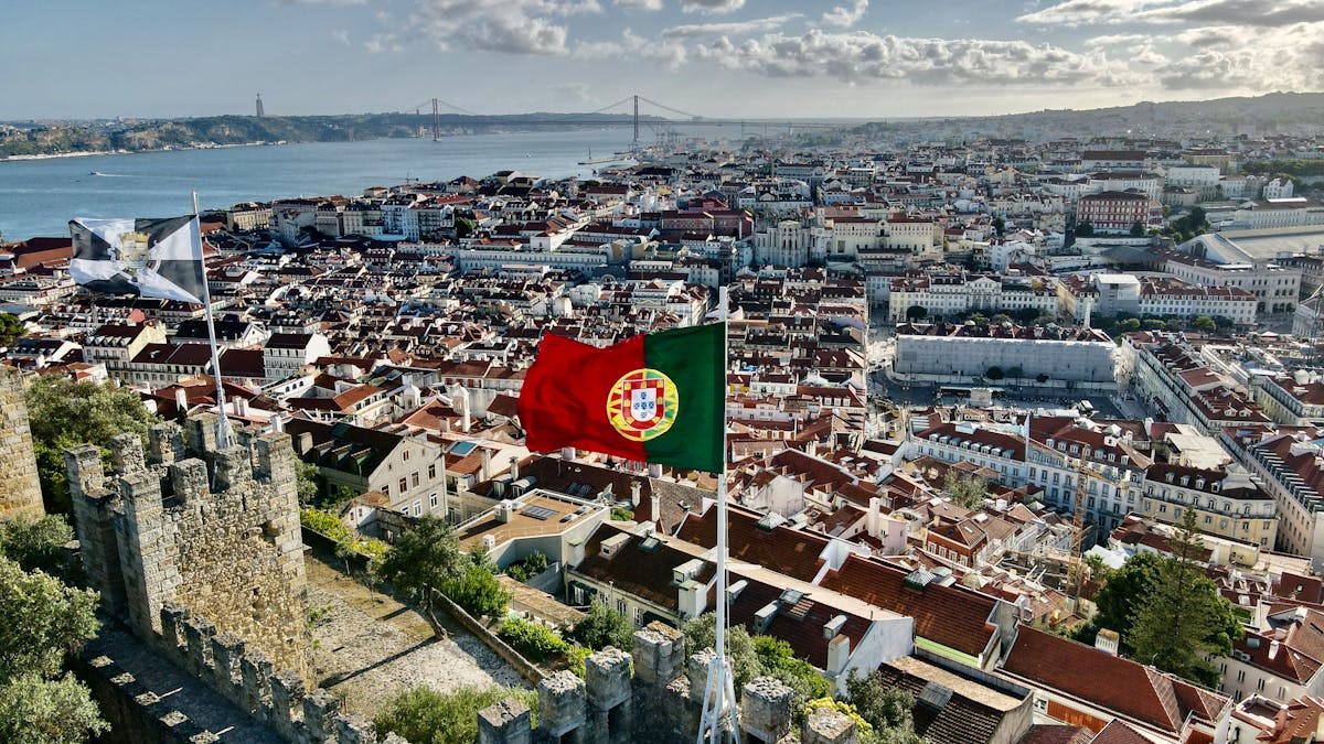 Panoramic view of Lisbon's terracotta rooftops and the River Tagus from the walls of Castelo de Sao Jorge