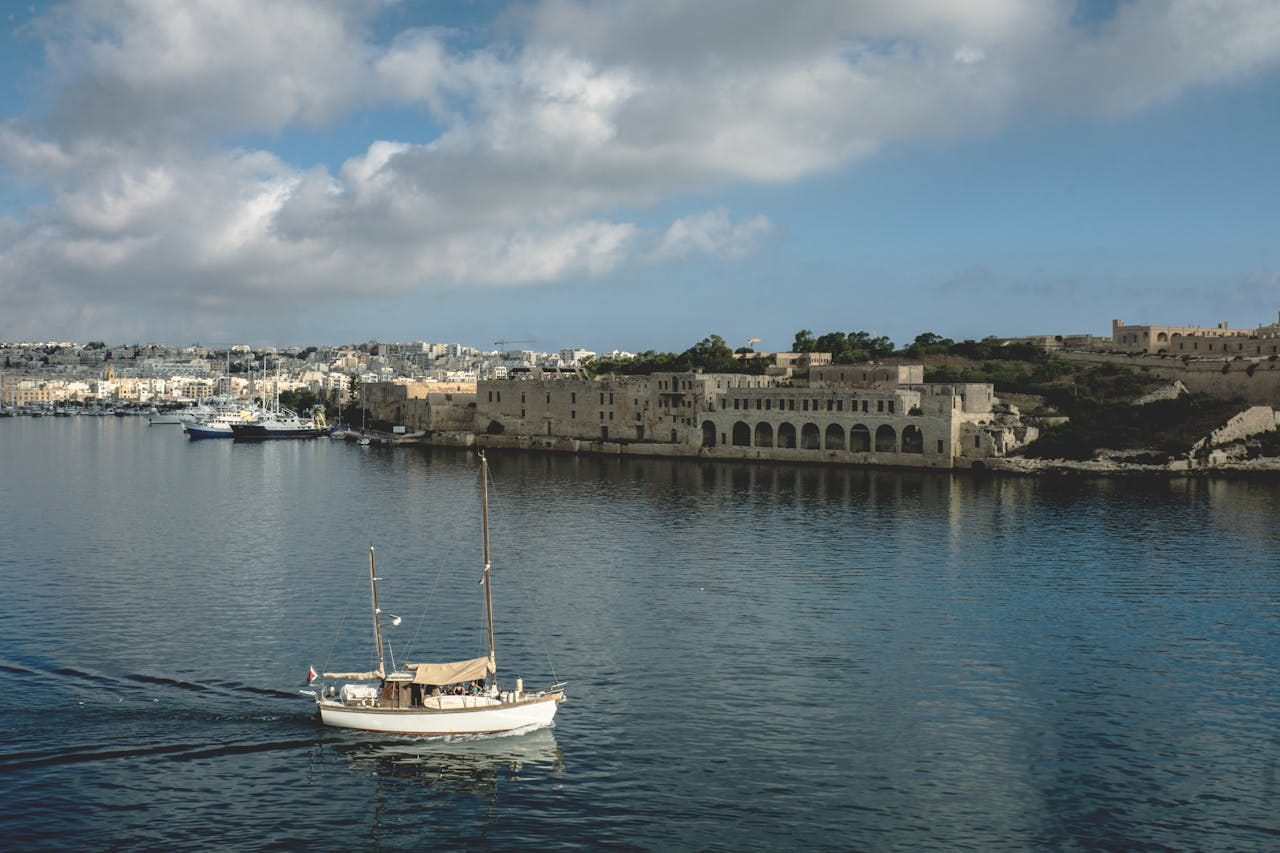 Boat on the Grand Harbour with Valletta's skyline, Malta