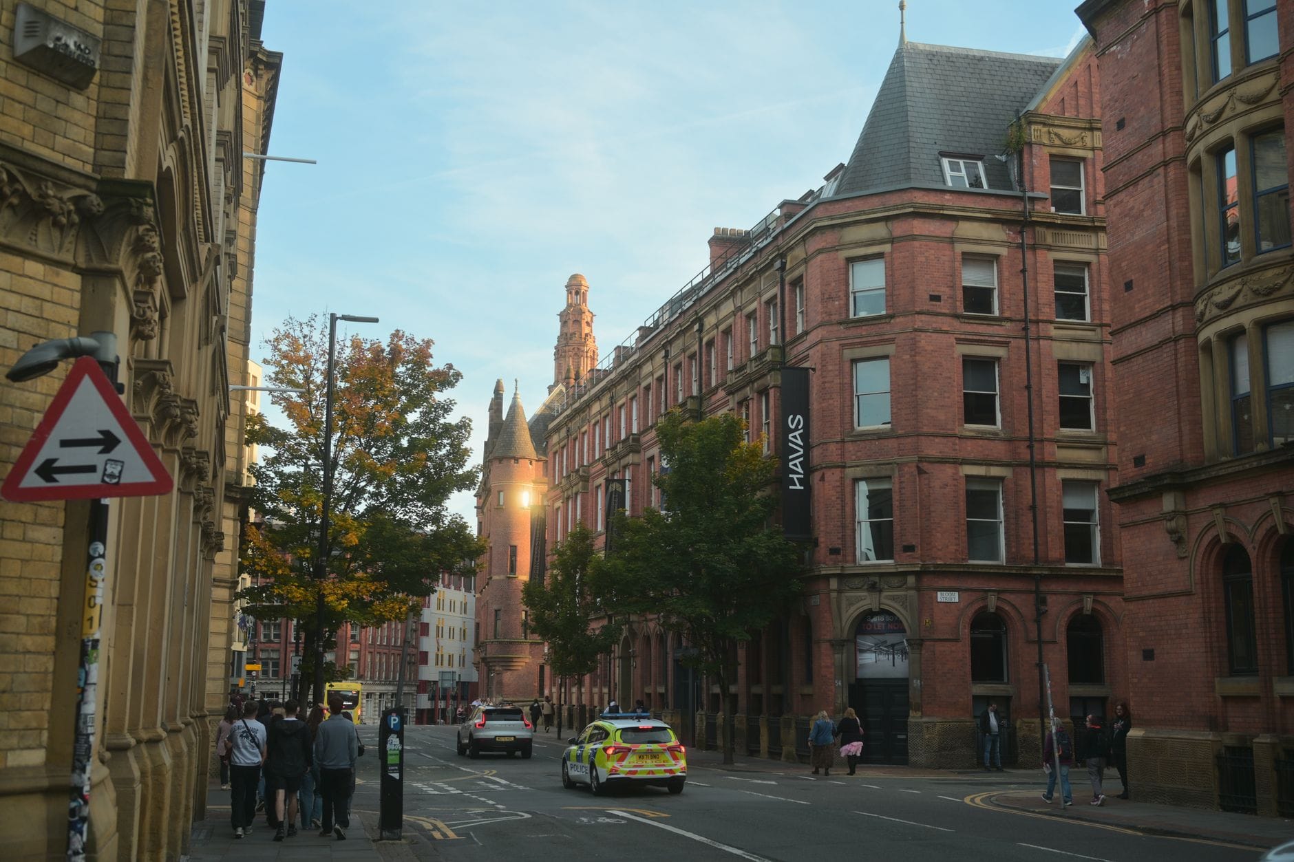 A red-brick street in central Manchester on an autumn morning
