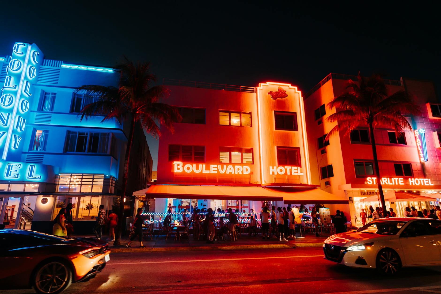 Art Deco hotels lit up at night on Ocean Drive, South Beach Miami