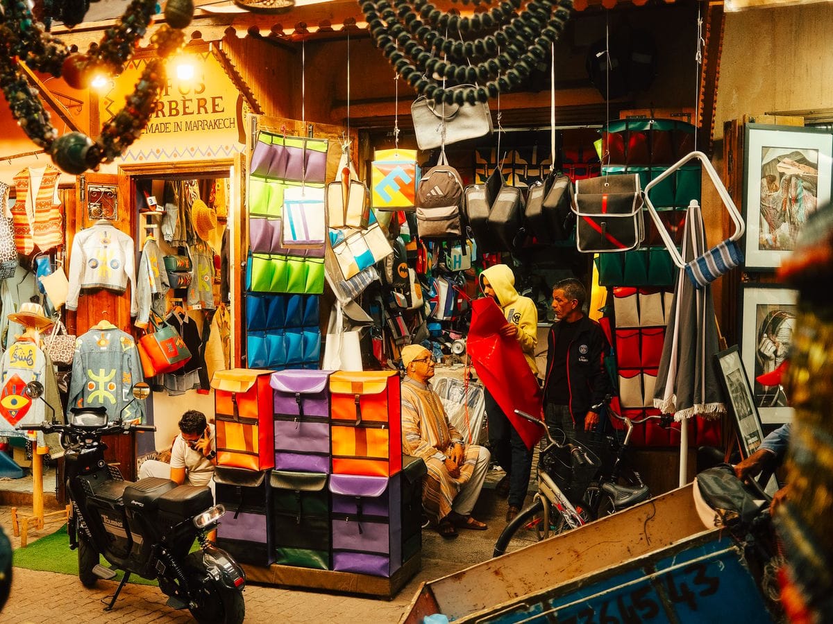 Colourful bags and crafts at a shop in the Marrakech medina, Morocco.