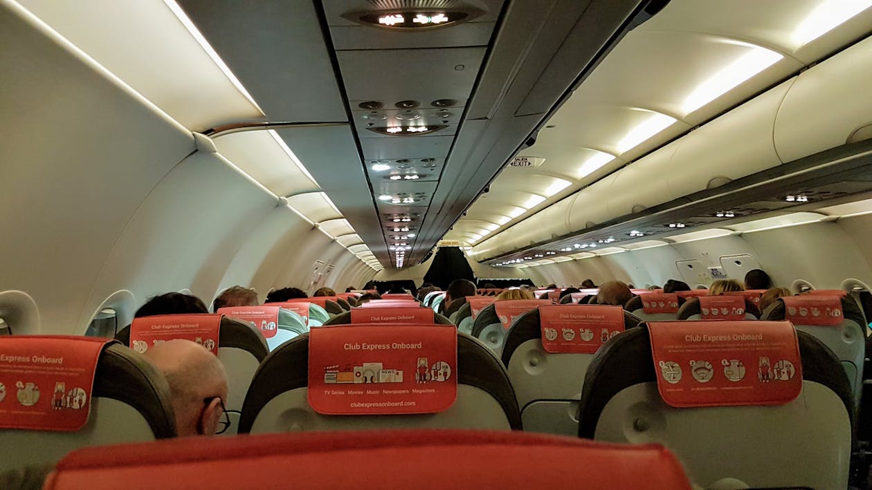 Passengers seated inside a budget airline cabin
