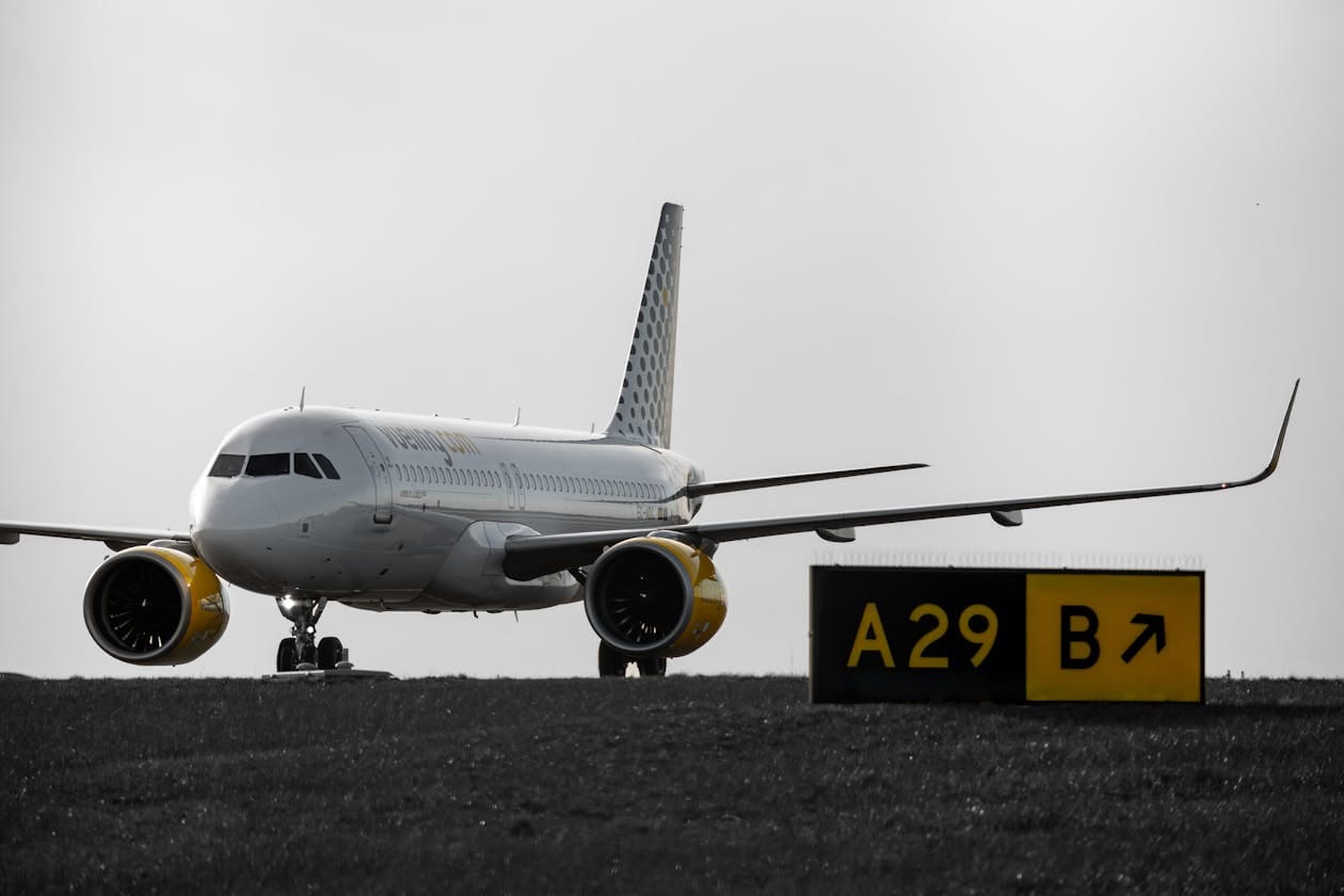 Budget airline aircraft taxiing on airport runway