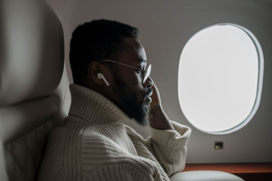 Passenger in a window seat on a long-haul flight