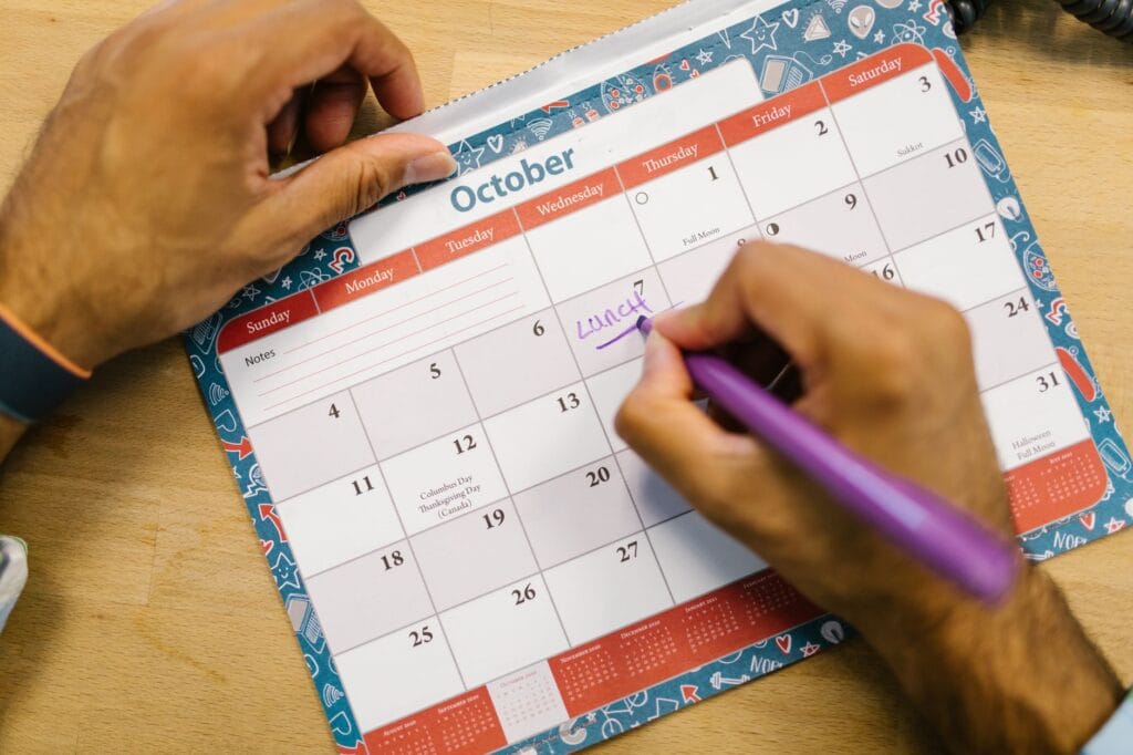 Calendar and laptop showing travel planning