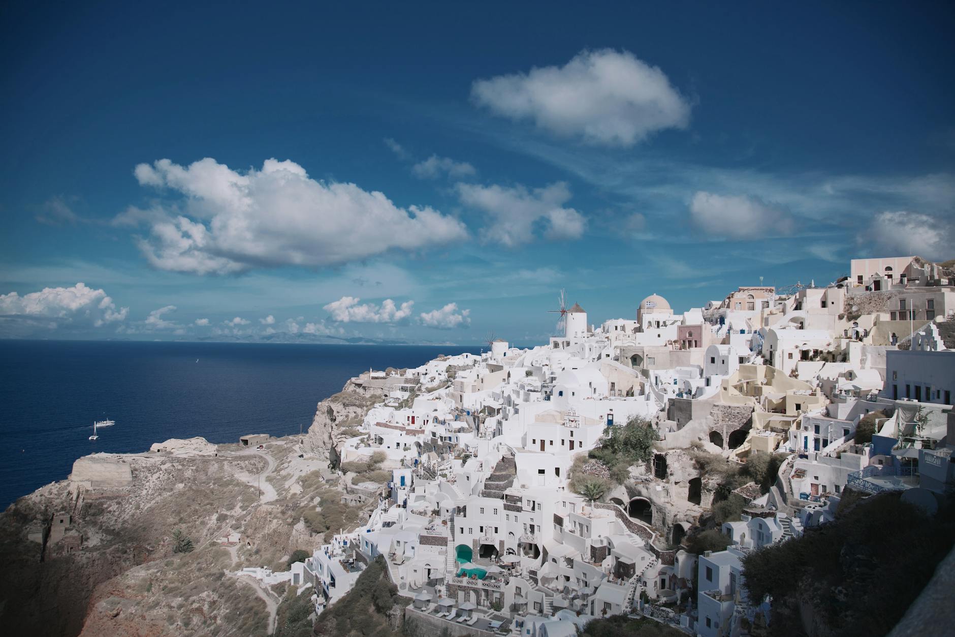 Whitewashed houses and blue-domed churches in Oia, Santorini, Greece