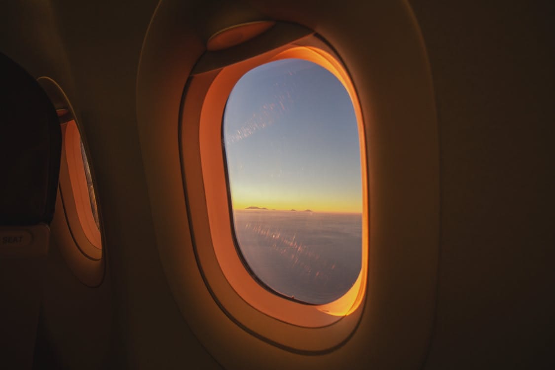View from an airplane window at sunrise