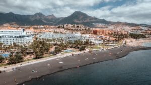 Aerial view of Adeje beachside resorts with mountains behind, Tenerife