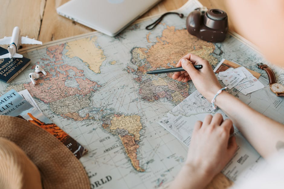Travel map with passport, camera and essentials