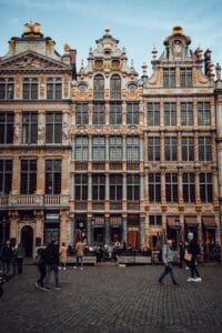 Visitors walk across Grand Place, Brussels' medieval city centre square