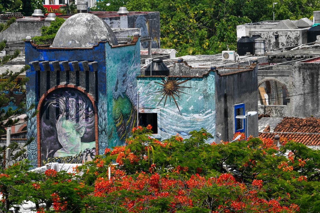 Colourful street murals painted on a wall in downtown Cancún, Mexico