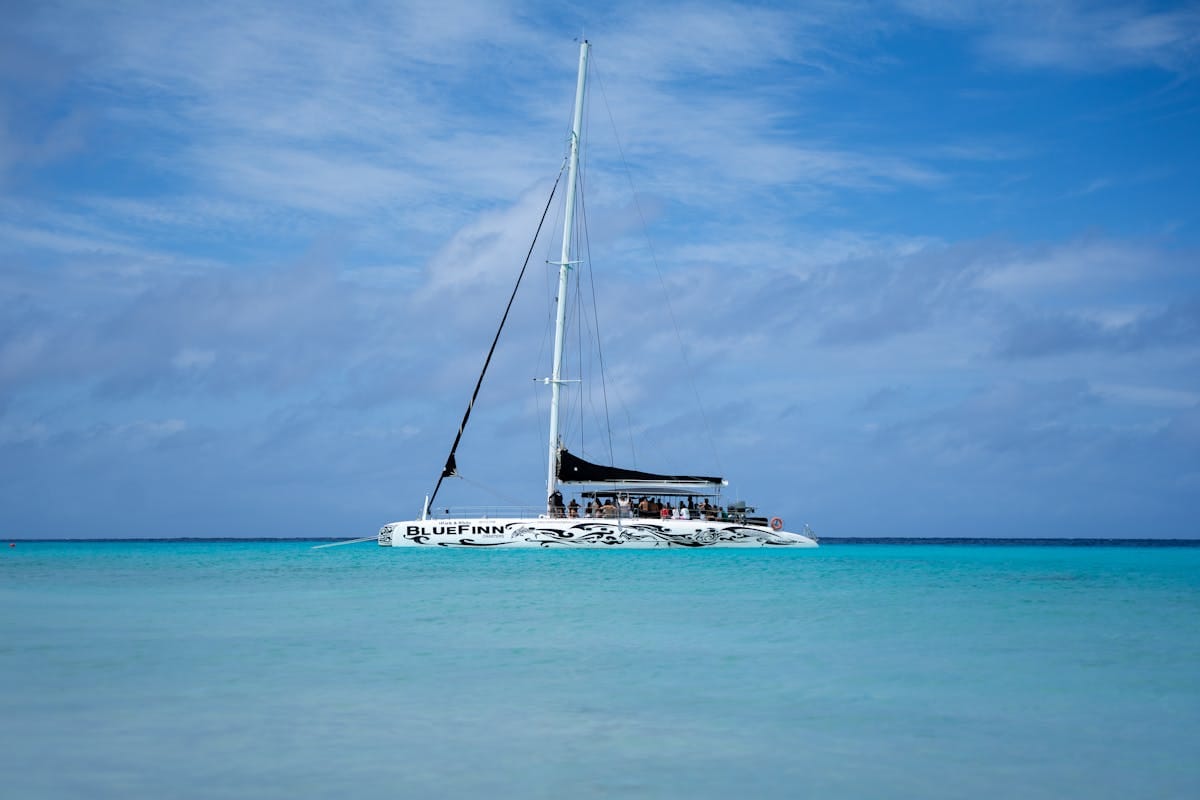 A catamaran day trip on turquoise water off Sal, Cape Verde, with a snorkelling stop
