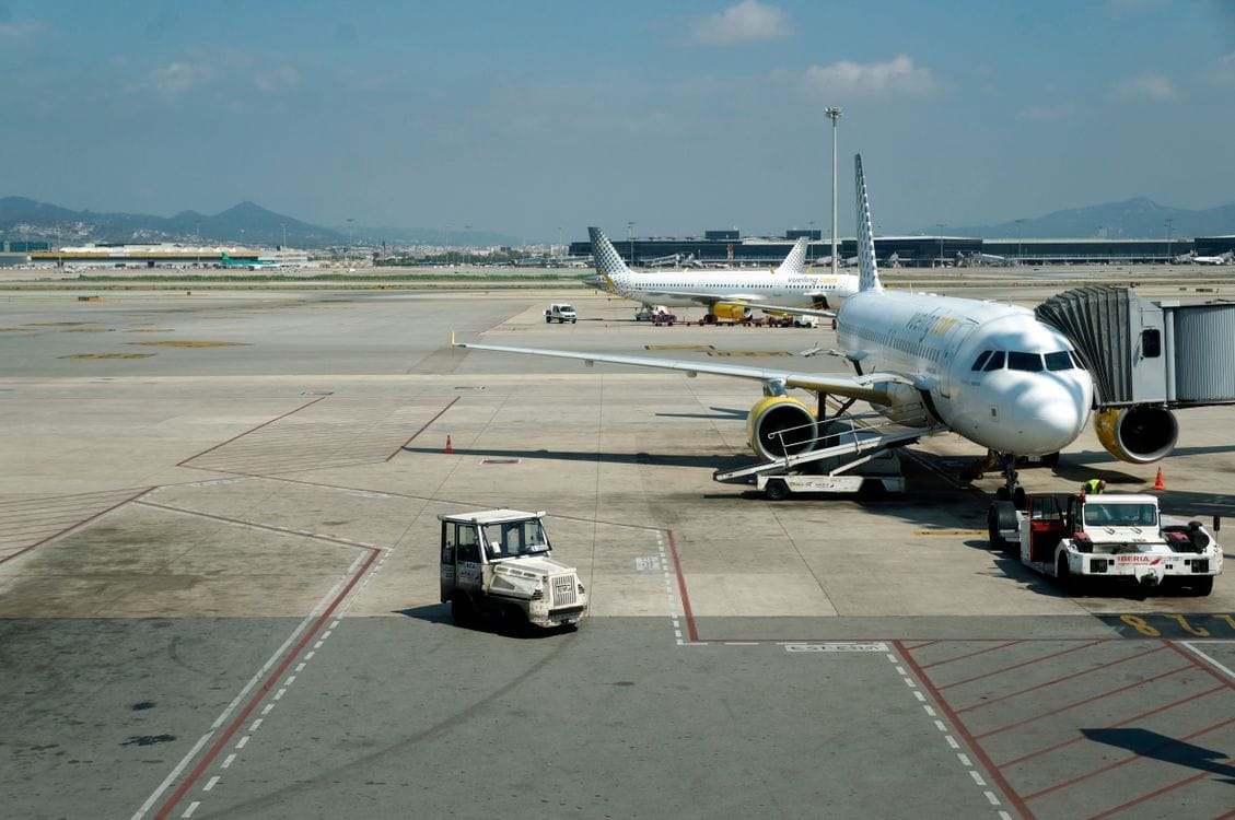 Passenger planes parked at an airport terminal