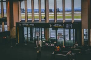 Airport terminal departures board, representing the decision to buy travel insurance