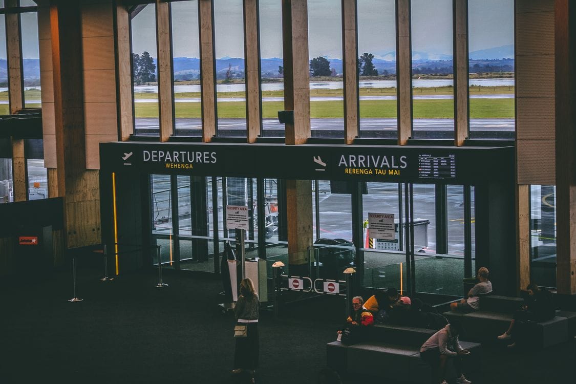 Airport terminal departures board, representing the decision to buy travel insurance