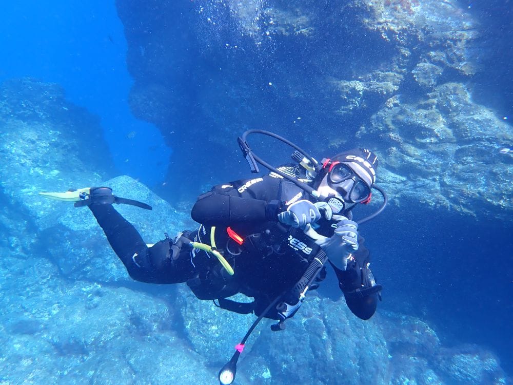 Scuba diver exploring the clear waters of La Restinga marine reserve, El Hierro