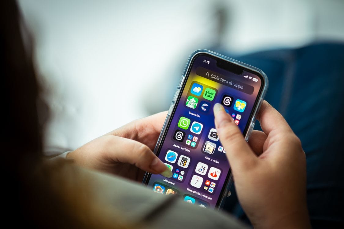 Person using smartphone to request a travel refund