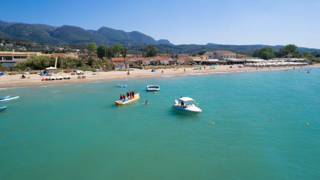 Families on a sunny Mediterranean beach holiday resort