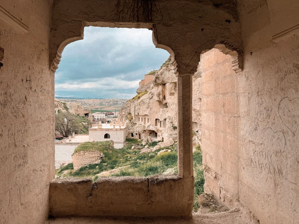 Cave hotel interior with stone walls and luxury furnishings in Cappadocia