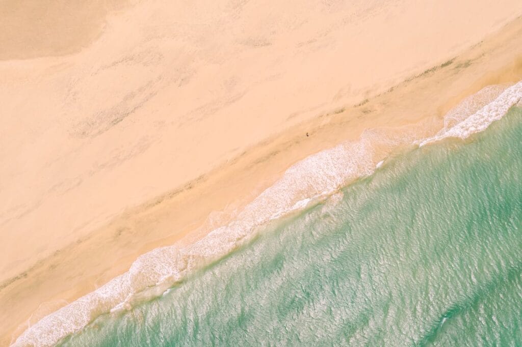 Fuerteventura sand dunes and turquoise sea from above