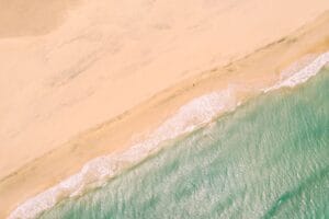 Fuerteventura sand dunes and turquoise sea from above