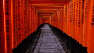 Red torii gate tunnel at Fushimi Inari Shrine in Kyoto, Japan