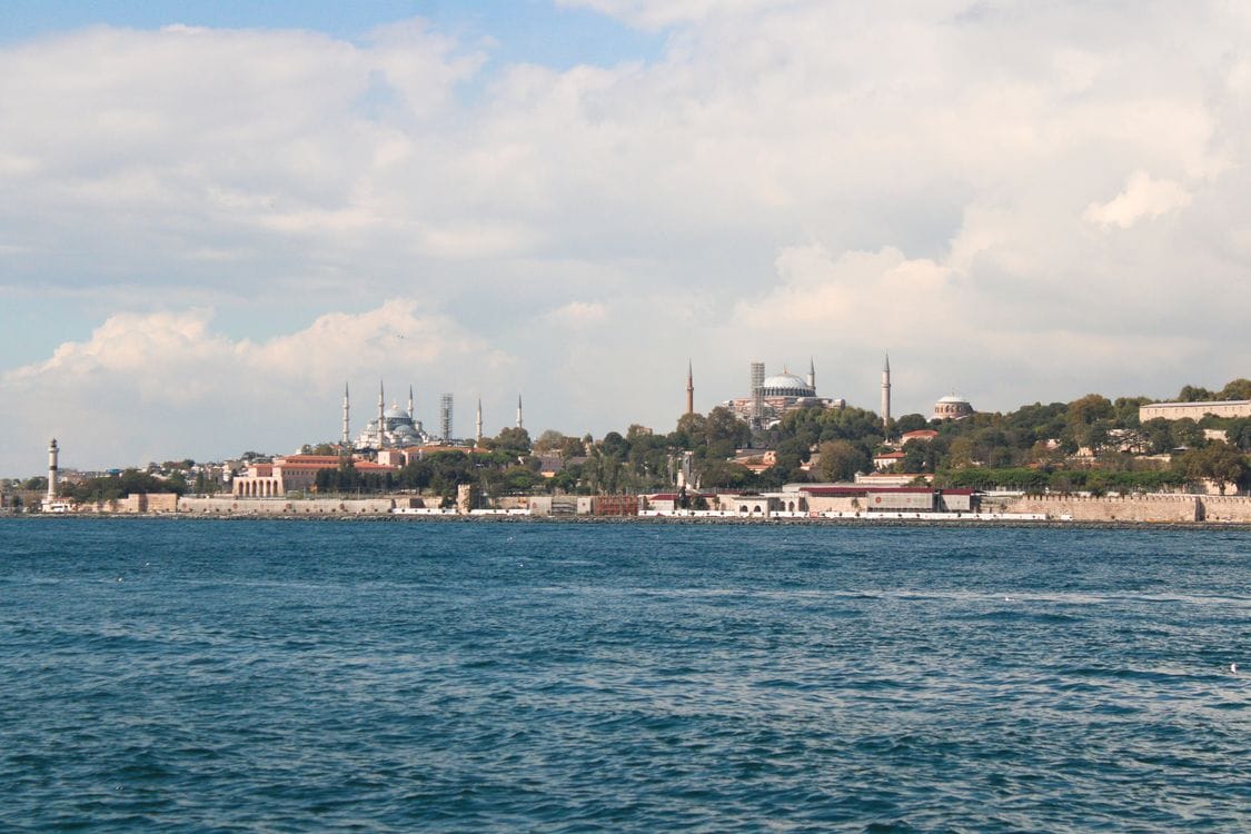 Panoramic view of Istanbul skyline from the Bosphorus showing Blue Mosque and Hagia Sophia