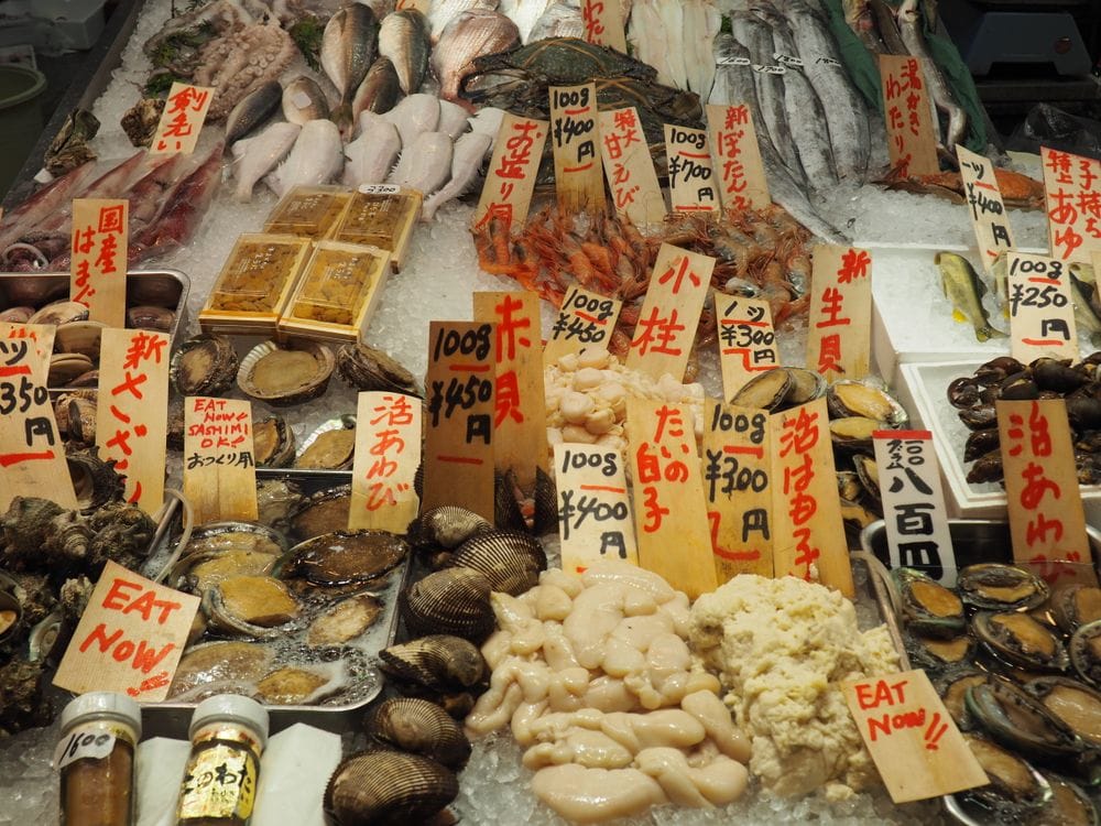 Fresh seafood on display at a Japanese market stall