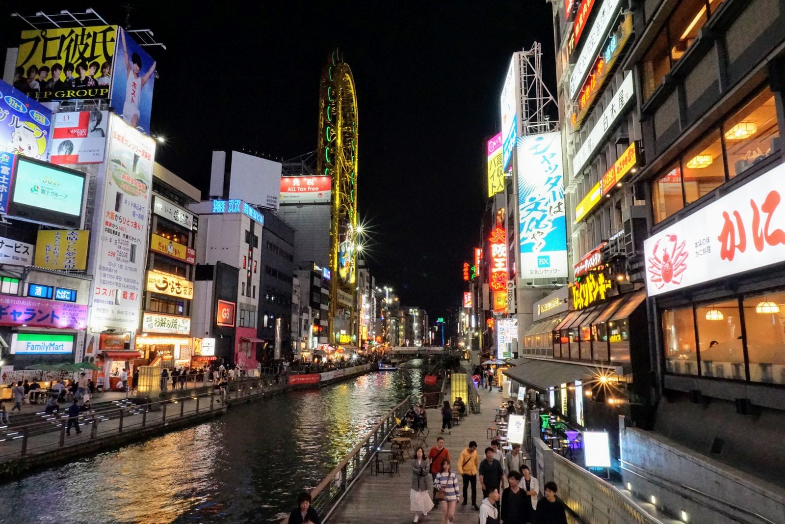 Dotonbori Canal at night, Osaka, with illuminated signs and restaurants