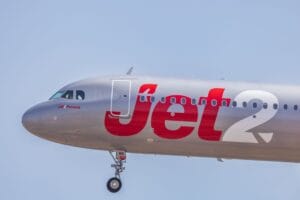 Jet2 aircraft in flight against clear blue sky