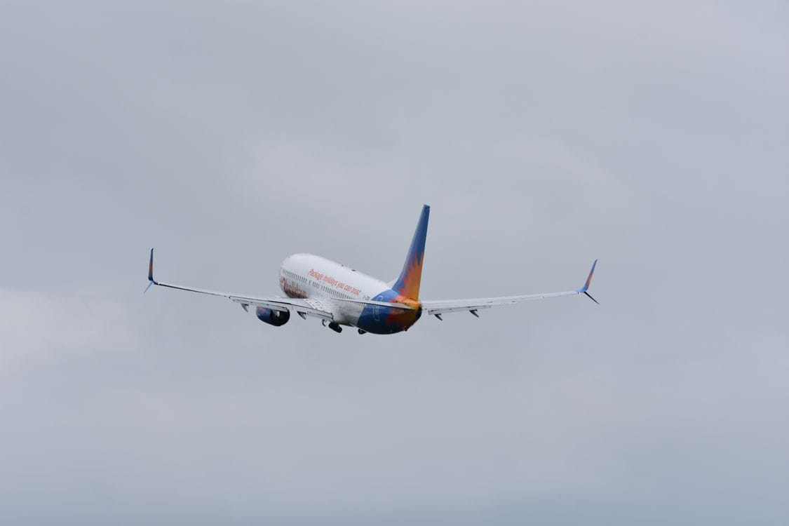 Jet2holidays aircraft climbing through clouds after take-off