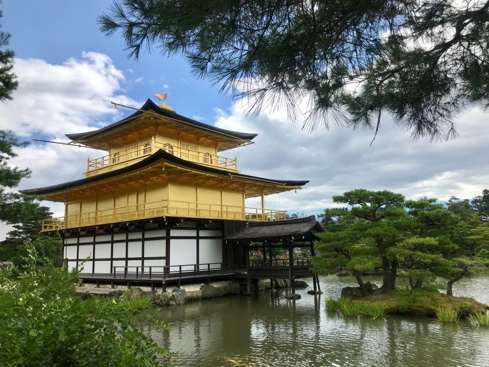 Kinkaku-ji golden pavilion reflected in the lake in Kyoto