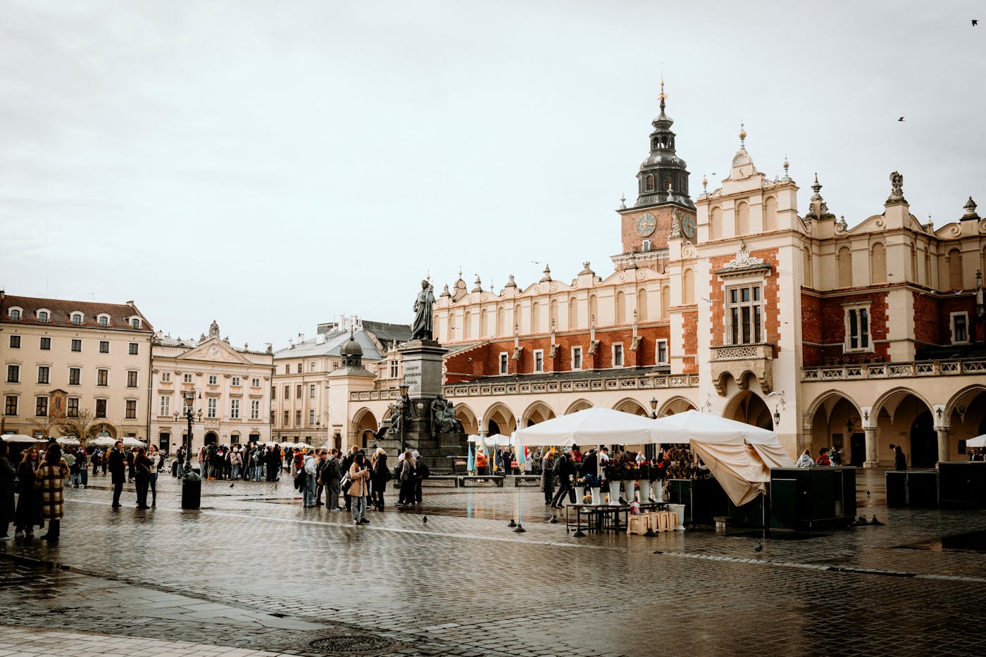 Crowds in front of the Cloth Hall and Adam Mickiewicz monument on Krakow Main Square