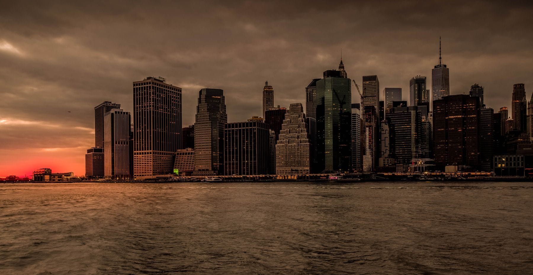 Dramatic sunset over the New York City skyline, a popular long-haul holiday from the UK
