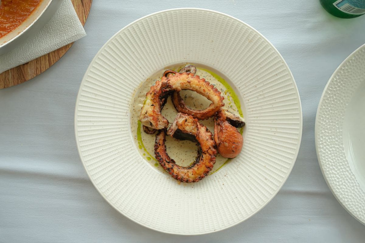 Grilled octopus served on a plate, a typical Maltese seafood dish