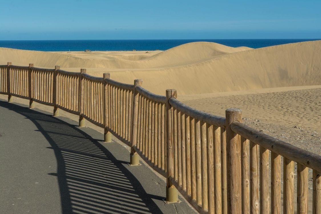 Boardwalk path through the Maspalomas dunes nature reserve, Gran Canaria, a free walk through 404 hectares of protected sand dunes