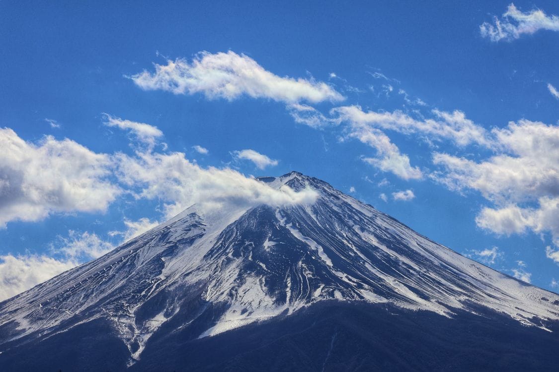 Mount Fuji covered in snow under a clear blue sky
